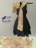 Black dress with a patterned scarf on a gray background, featuring the 'Maritime Tribes' brand.