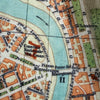Vintage map detail showing a river and surrounding streets with Italian text