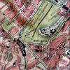 Vintage map detail showing streets and landmarks with a colorful layout.