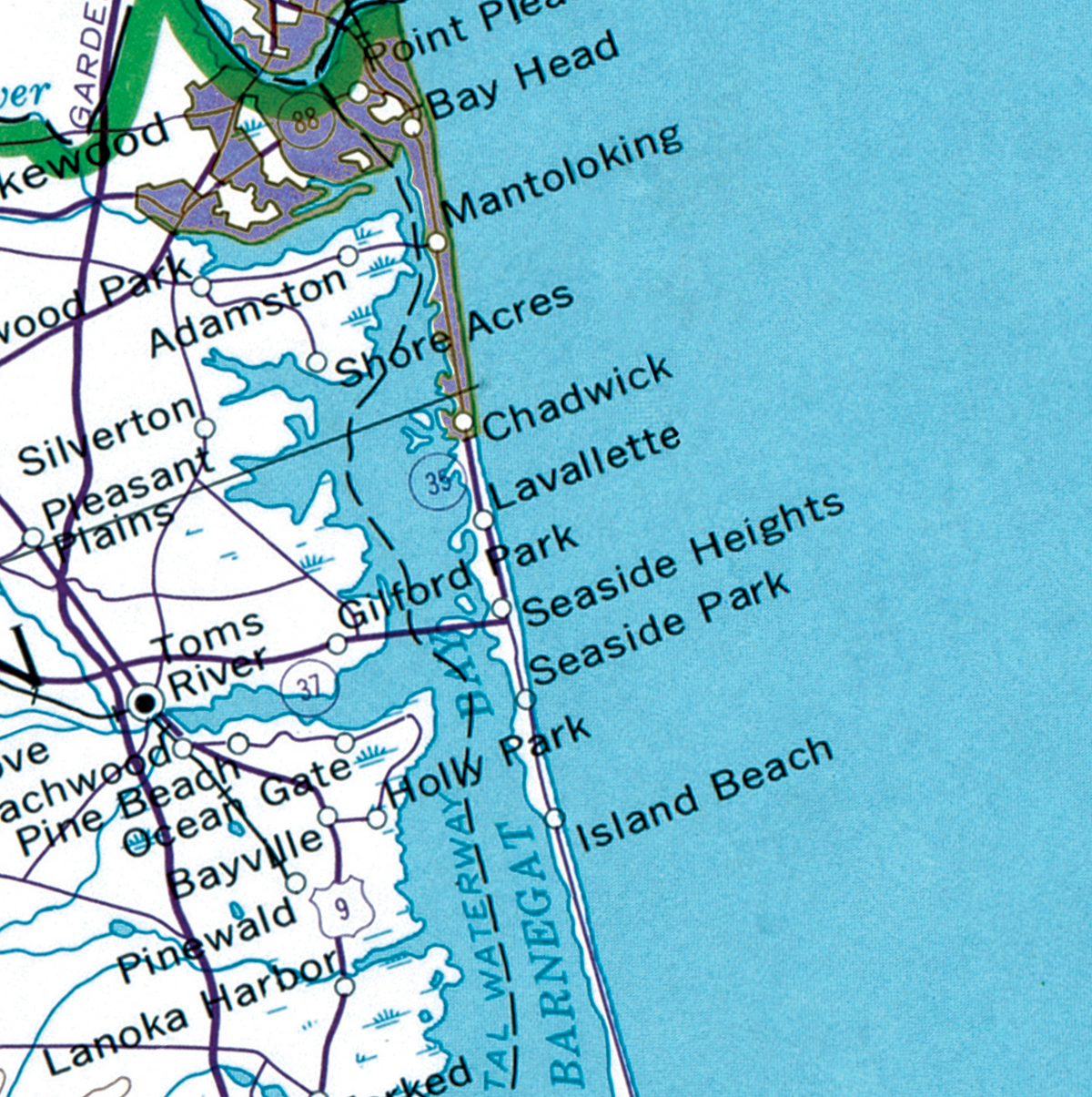 A close-up of a vintage nautical chart or map showing shoreline labels such as Point Pleas, Bay Head, Mantoloking, Shore Acres, Chadwick, Lavalle, Holiv, Barnegat, Island Beach, and other coastal place names over blue water and land areas.
