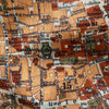 Textured fabric with printed map design featuring various labels and text.