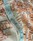 Close-up of an old map with streets and buildings labeled