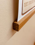 a close up of a wooden frame on a wall